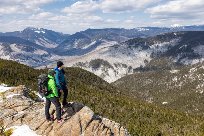 Hikers Enjoying Winter Mountain Top Views