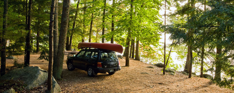 a car with a canoe on top