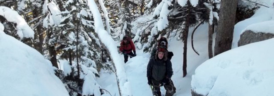 2 People hiking Mount Cardigan in the snow