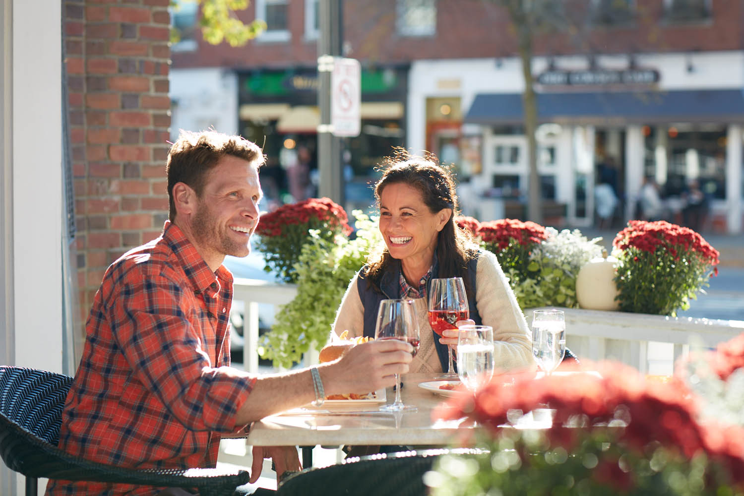 Man and woman dining outside